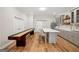 Well-equipped bar area with a large island, ample cabinetry, seating, and shuffleboard for entertaining at 210 Steeple Point Dr, Roswell, GA 30076