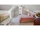 Charming bedroom featuring vaulted ceilings, soft lighting, and plush carpets at 210 Steeple Point Dr, Roswell, GA 30076