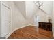Bonus room with hardwood floors, a classic dresser, and lots of natural light at 210 Steeple Point Dr, Roswell, GA 30076