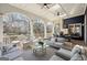 Large covered patio features outdoor seating and a dining area with views of the yard at 210 Steeple Point Dr, Roswell, GA 30076