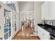 Bright foyer featuring hardwood floors and a glimpse into the open-concept living space at 210 Steeple Point Dr, Roswell, GA 30076