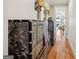 Hallway with decorative cabinet and mirror at 210 Steeple Point Dr, Roswell, GA 30076