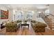 Elegant living room features hardwood floors, two couches, and a decorative chandelier at 210 Steeple Point Dr, Roswell, GA 30076