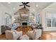 Inviting living room with stone fireplace, built-in shelving, and ample seating at 210 Steeple Point Dr, Roswell, GA 30076