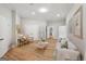 Bright living room featuring hardwood floors, recessed lighting, and neutral decor at 210 Steeple Point Dr, Roswell, GA 30076