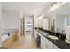 Spacious bathroom features double sinks, marble countertops, tiled floors, shower and separate soaking tub at 210 Steeple Point Dr, Roswell, GA 30076