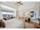 Bright main bedroom features a sitting area, coffered ceilings, and beautiful hardwood floors at 210 Steeple Point Dr, Roswell, GA 30076