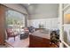 Office space with large windows and traditional desk at 210 Steeple Point Dr, Roswell, GA 30076
