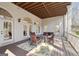 Covered outdoor patio with a dining set, perfect for entertaining and relaxation at 210 Steeple Point Dr, Roswell, GA 30076