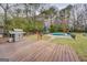 Backyard featuring an entertaining deck, grill, and swimming pool at 10174 Twin Oaks Sw Dr, Covington, GA 30014