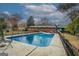Backyard featuring a refreshing in-ground pool surrounded by an iron fence at 10174 Twin Oaks Sw Dr, Covington, GA 30014