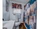 Cozy bathroom with a decorative shower curtain and natural light from the window at 10174 Twin Oaks Sw Dr, Covington, GA 30014
