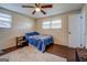 Bedroom with ceiling fan and natural light, creating a restful atmosphere perfect for relaxation and privacy at 10174 Twin Oaks Sw Dr, Covington, GA 30014