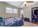 Bedroom featuring ceiling fan and access to en-suite bathroom, blending convenience and personal space at 10174 Twin Oaks Sw Dr, Covington, GA 30014