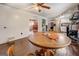 Dining area with a view to kitchen and seating, adjacent to kitchen appliances at 10174 Twin Oaks Sw Dr, Covington, GA 30014
