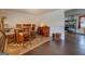 Open dining area with a rustic round table and chairs, flowing into kitchen at 10174 Twin Oaks Sw Dr, Covington, GA 30014
