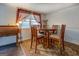 Cozy dining room featuring a round table, wooden chairs, and soft lighting at 10174 Twin Oaks Sw Dr, Covington, GA 30014