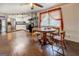 Combined dining and kitchen area with a wooden table and ceiling fan at 10174 Twin Oaks Sw Dr, Covington, GA 30014