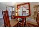 Dining area with a round table, four chairs, and bright window light at 10174 Twin Oaks Sw Dr, Covington, GA 30014