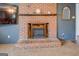 A close-up view of a brick fireplace, complete with a mantle and hearth at 10174 Twin Oaks Sw Dr, Covington, GA 30014