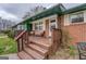 Cozy front porch with wooden steps and a seating area at 10174 Twin Oaks Sw Dr, Covington, GA 30014