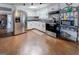 Functional kitchen featuring white cabinets and stainless steel appliances at 10174 Twin Oaks Sw Dr, Covington, GA 30014