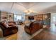 Spacious living room with brick fireplace, plush seating, and built-in shelving at 10174 Twin Oaks Sw Dr, Covington, GA 30014