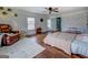 Large main bedroom offers hardwood floors, seating area, and ample natural light at 10174 Twin Oaks Sw Dr, Covington, GA 30014