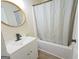 Bathroom with updated vanity and shower-tub combination at 97 College St, Temple, GA 30179