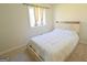 Cozy bedroom showcasing a comfortable bed and natural light at 97 College St, Temple, GA 30179