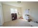 Bright bedroom featuring neutral walls and carpet at 97 College St, Temple, GA 30179