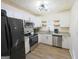 Modern kitchen featuring stainless steel appliances and white cabinets at 97 College St, Temple, GA 30179