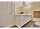 Bright bathroom with double vanity, ample storage, and elegant mirrors, creating a spa-like feel at 215 Farr Lake Dr, Tyrone, GA 30290