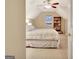Comfortable bedroom with a sloped ceiling, cozy bed and a bookshelf at 215 Farr Lake Dr, Tyrone, GA 30290
