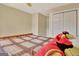 Cozy bedroom featuring neutral walls and a bed with a patterned comforter at 215 Farr Lake Dr, Tyrone, GA 30290