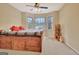 Inviting bedroom with a wooden bed frame and a bay window letting in natural light at 215 Farr Lake Dr, Tyrone, GA 30290