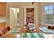 Inviting breakfast nook with a table set for four and an open pantry in the background at 215 Farr Lake Dr, Tyrone, GA 30290