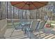 View of outdoor deck featuring table with umbrella at 215 Farr Lake Dr, Tyrone, GA 30290