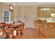 Charming dining area with wood table, chairs, and natural light from a nearby window, perfect for Gathering meals at 215 Farr Lake Dr, Tyrone, GA 30290