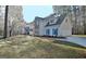 Charming two-story home featuring stone accents, blue shutters, and an attached two-car garage at 215 Farr Lake Dr, Tyrone, GA 30290