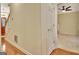 Hallway view with hardwood floors, leading to the front door and other rooms in the house at 215 Farr Lake Dr, Tyrone, GA 30290