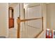 Hallway overlooking the foyer and featuring a hall chest and double door closets at 215 Farr Lake Dr, Tyrone, GA 30290