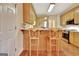 Kitchen counter with barstool seating and stainless steel appliances at 215 Farr Lake Dr, Tyrone, GA 30290