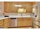 Well-appointed kitchen features a stainless steel refrigerator, ample cabinet space, and modern appliances at 215 Farr Lake Dr, Tyrone, GA 30290