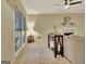 Inviting living room featuring a fireplace, windows with blinds, and neutral carpet at 215 Farr Lake Dr, Tyrone, GA 30290