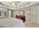 Bright main bedroom showcasing a comfortable bed and neutral decor, creating a serene atmosphere at 215 Farr Lake Dr, Tyrone, GA 30290