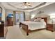 Spacious primary bedroom with tray ceiling, en-suite bathroom and private outdoor access at 215 Farr Lake Dr, Tyrone, GA 30290