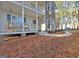 Inviting front porch with white railings, stone accents, and outdoor seating at 215 Farr Lake Dr, Tyrone, GA 30290