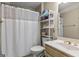 Bathroom with a shower and tub combination, a white shower curtain, and ample storage at 125 Tall Timber Ct, Fayetteville, GA 30215