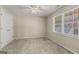 Bright, carpeted bedroom with natural light and a large window at 125 Tall Timber Ct, Fayetteville, GA 30215